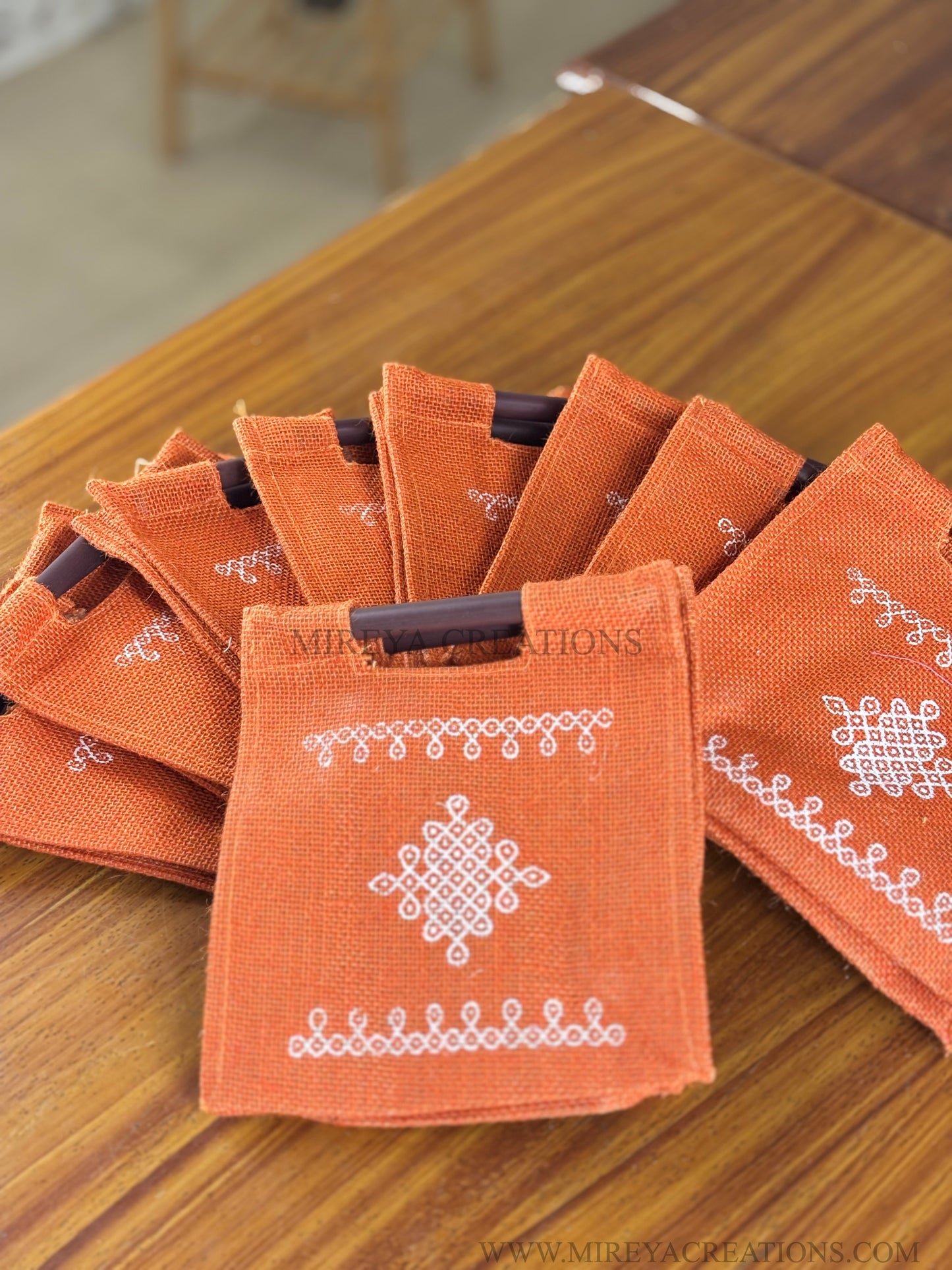 Orange Kolam Jute Bag Return Gift | Handcrafted Jute Bag with Wooden Handle | Wedding & Festive Favor Under ₹100